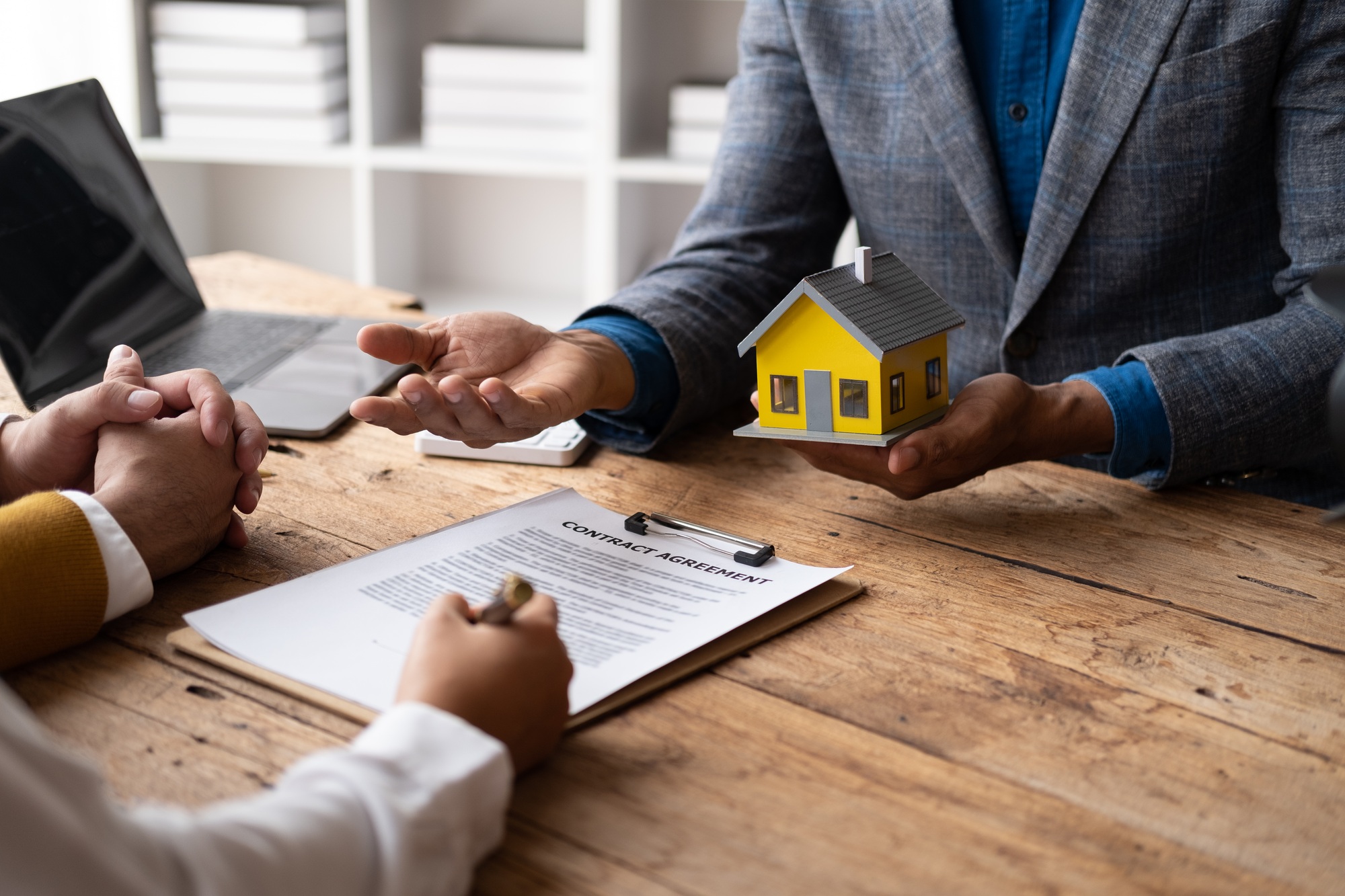 Mortgage and real estate property investment concept. Real estate agent explain terms and condition
