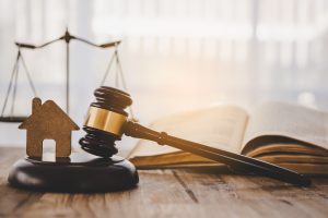 Model of house and gavel.House auction real estate law concept.